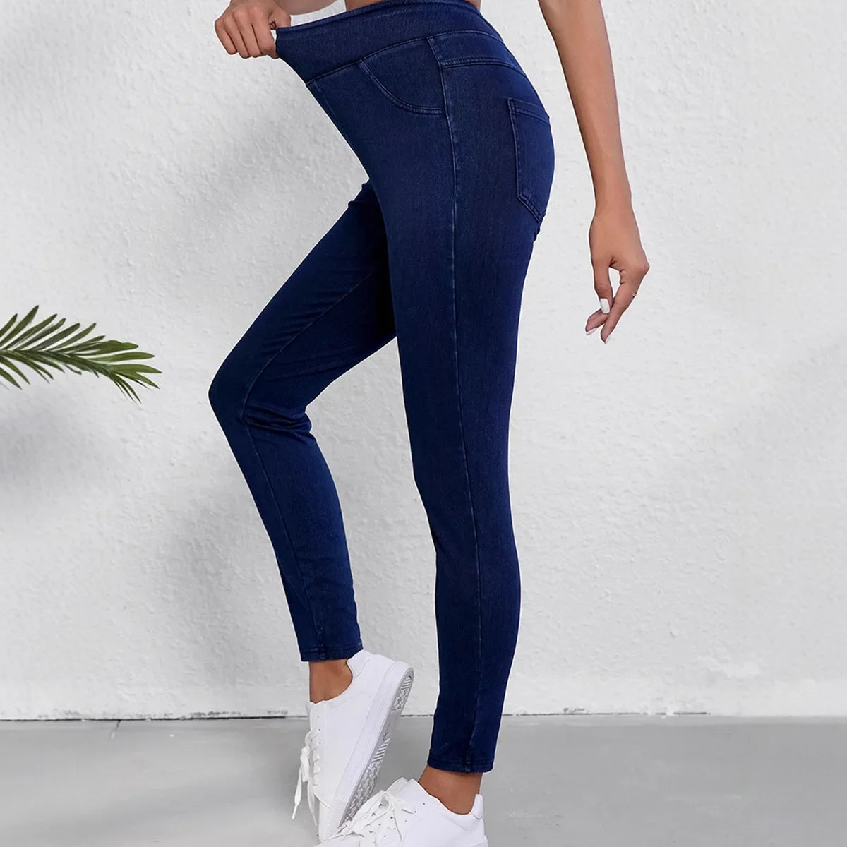 Women’s high-rise stretch jeans from Jesie-London featuring a slim fit and high-waisted style, shown in a natural pose.