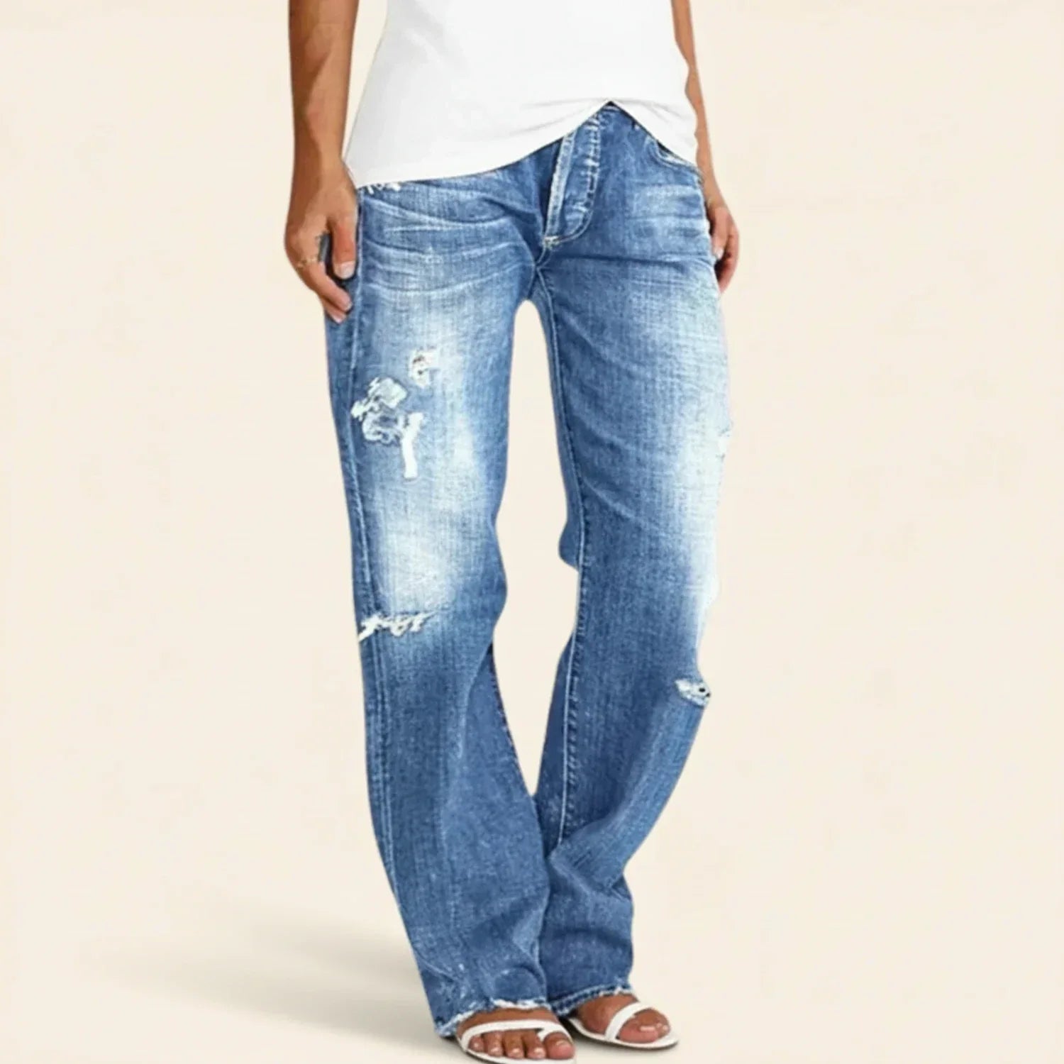 Women’s ripped high-rise straight jeans by Jesie-London, featuring distressed details and a classic fit, styled on a model.