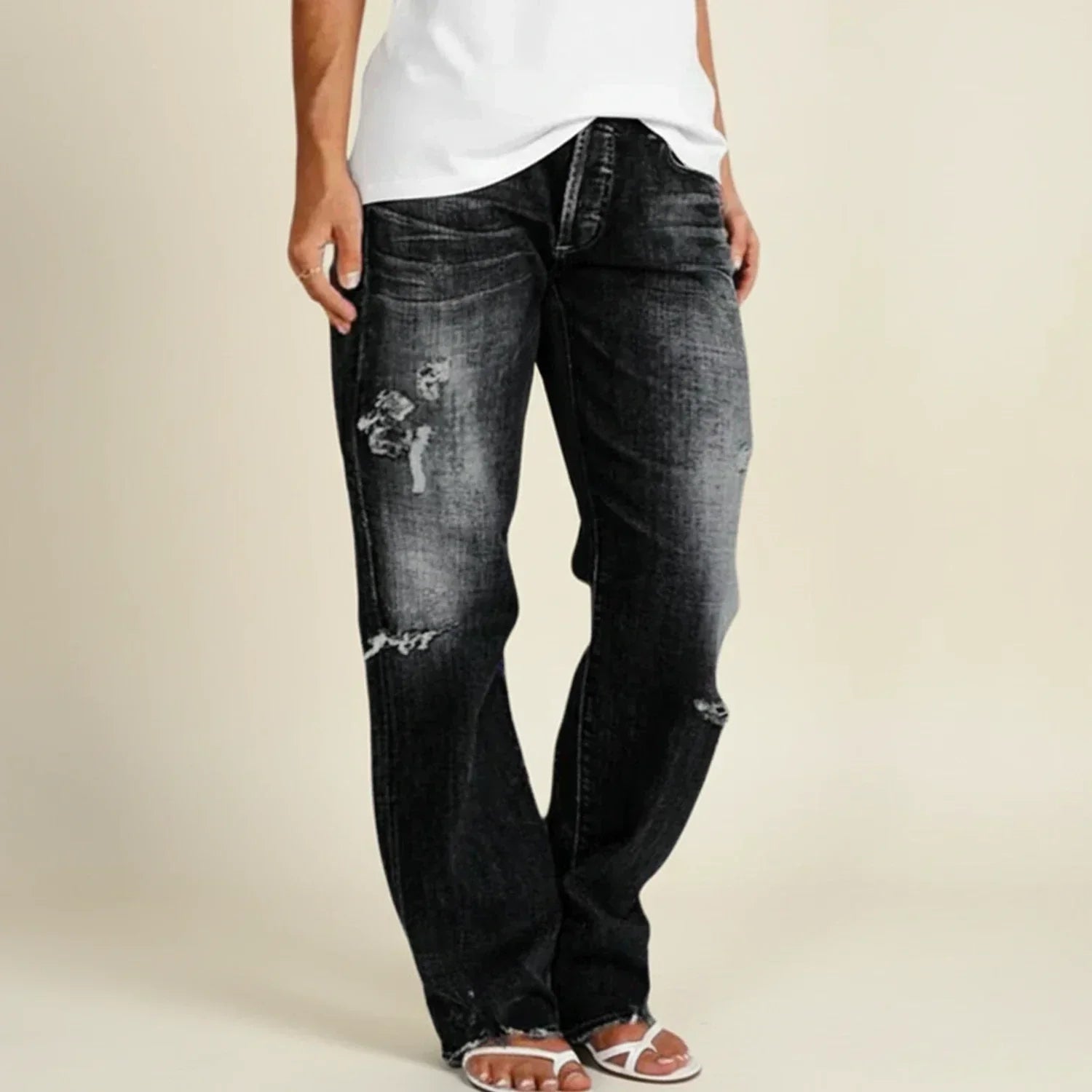 Women’s ripped high-rise straight jeans by Jesie-London featuring distressed details and a classic fit.