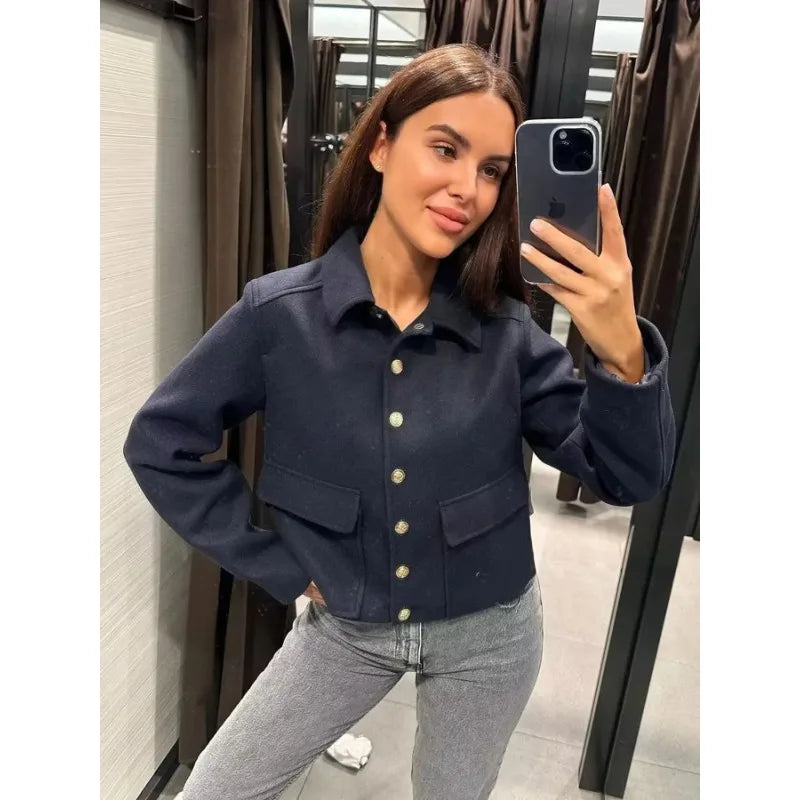 Women's cropped button-front bomber jacket by Jesie-London, featuring a stylish design with front button closure and fitted silhouette.