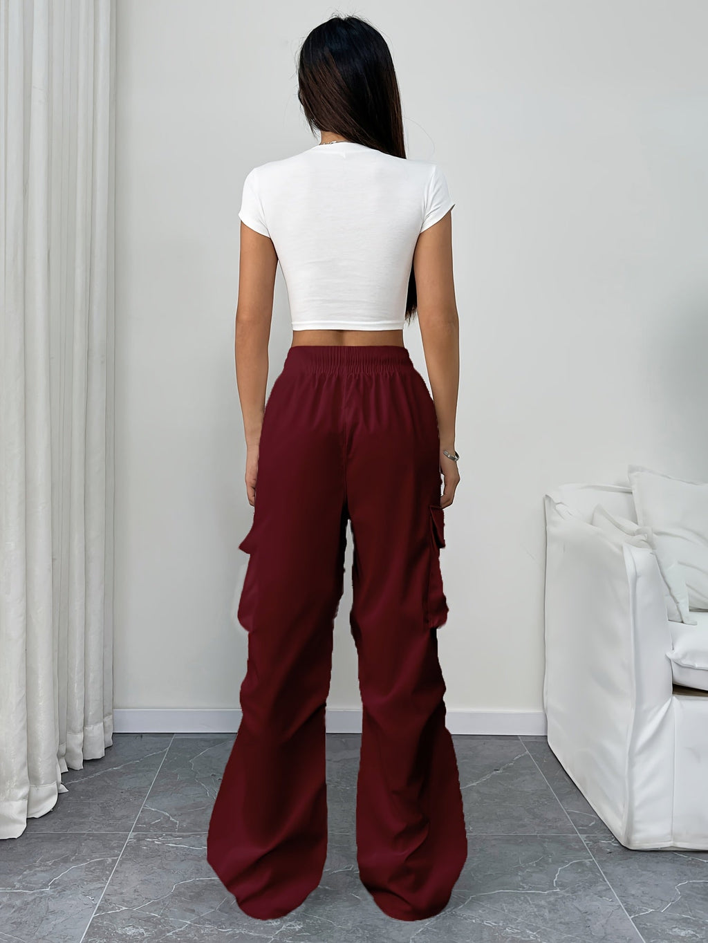 Women's wide-leg cargo pants with drawstring waist and multiple cargo pockets, by Jesie-London, shown in a relaxed fit style.
