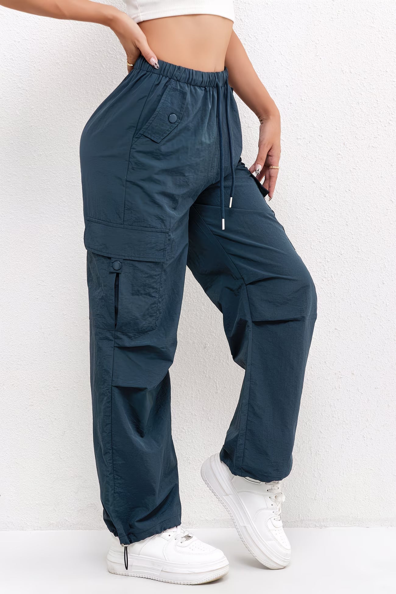 Women's casual cargo pants with drawstring waist and multiple pockets, by Jesie-London, shown on a model.