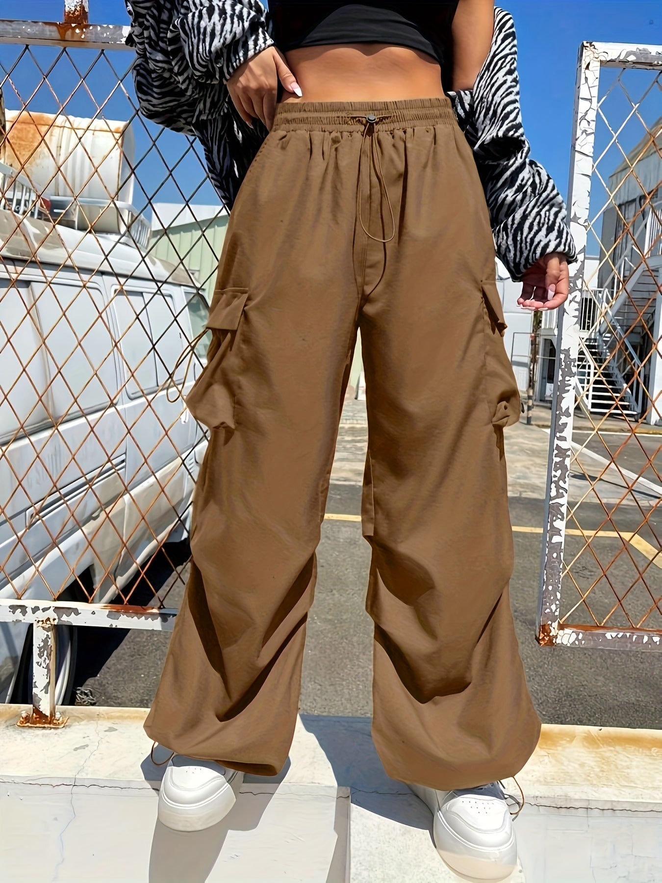 Women's wide-leg cargo pants with large pockets, casual loose fit, parachute style by Jesie-London.