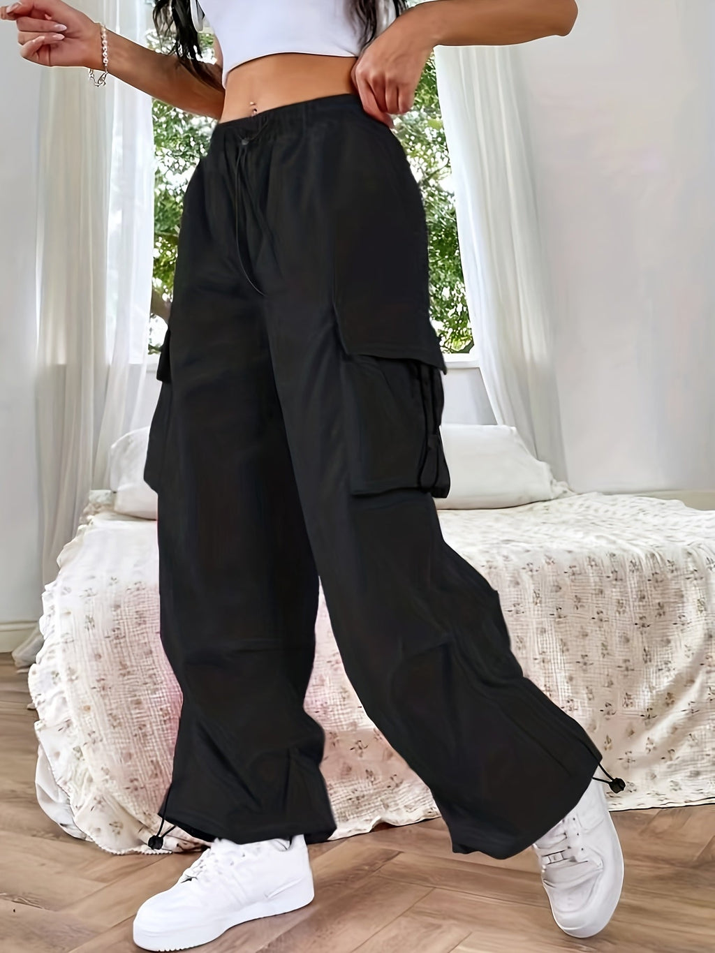 Women's wide-leg cargo pants by Jesie-London featuring multiple cargo pockets and a relaxed, casual fit.