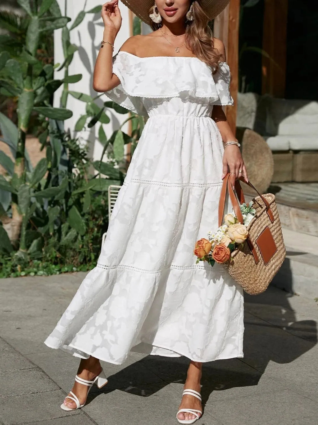 Women's off-shoulder tiered maxi wedding guest dress by Jesie-London, featuring ruffled layers and a flowing summer style.