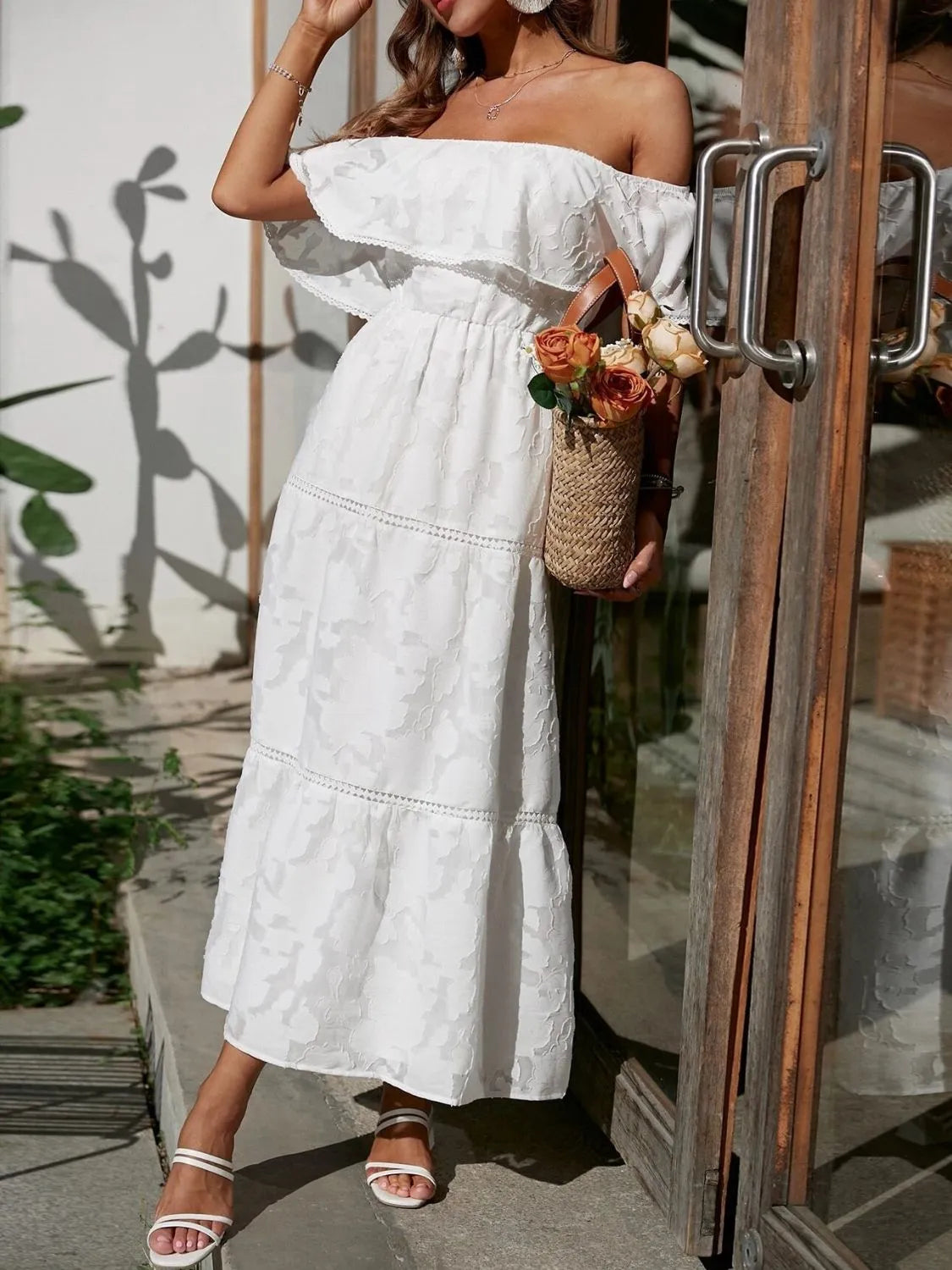 Women's off-shoulder ruffled tiered maxi dress by Jesie-London, perfect for summer wedding guests, featuring a flowy, elegant design.