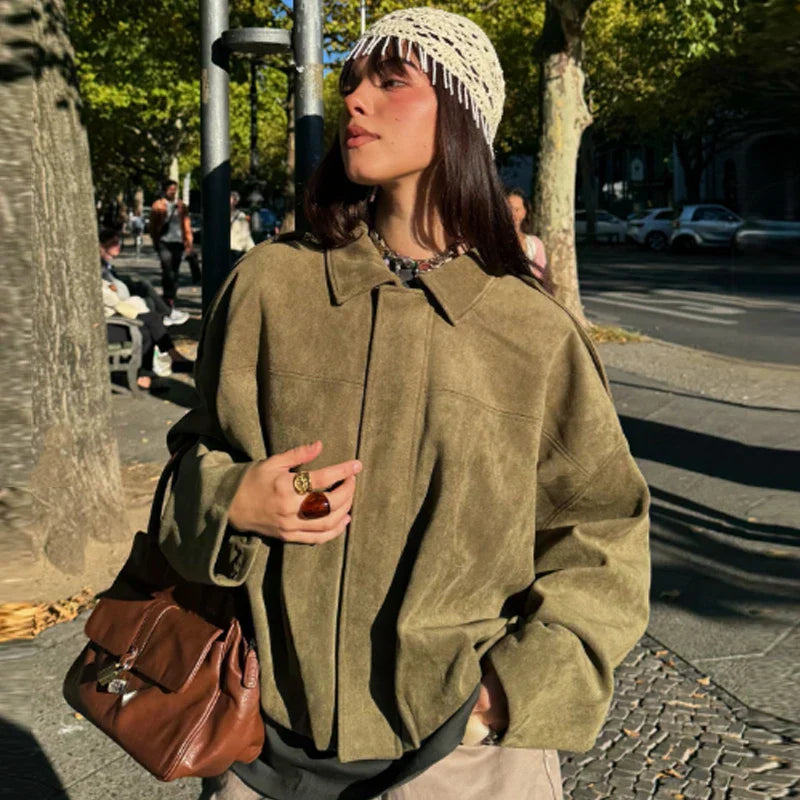 Women's cropped zip-up bomber jacket by Jesie-London, showing a stylish oversized design with a front zipper and fitted silhouette.