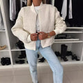 Women's quilted zip-up bomber jacket by Jesie-London featuring a stylish quilted pattern and front zipper closure.