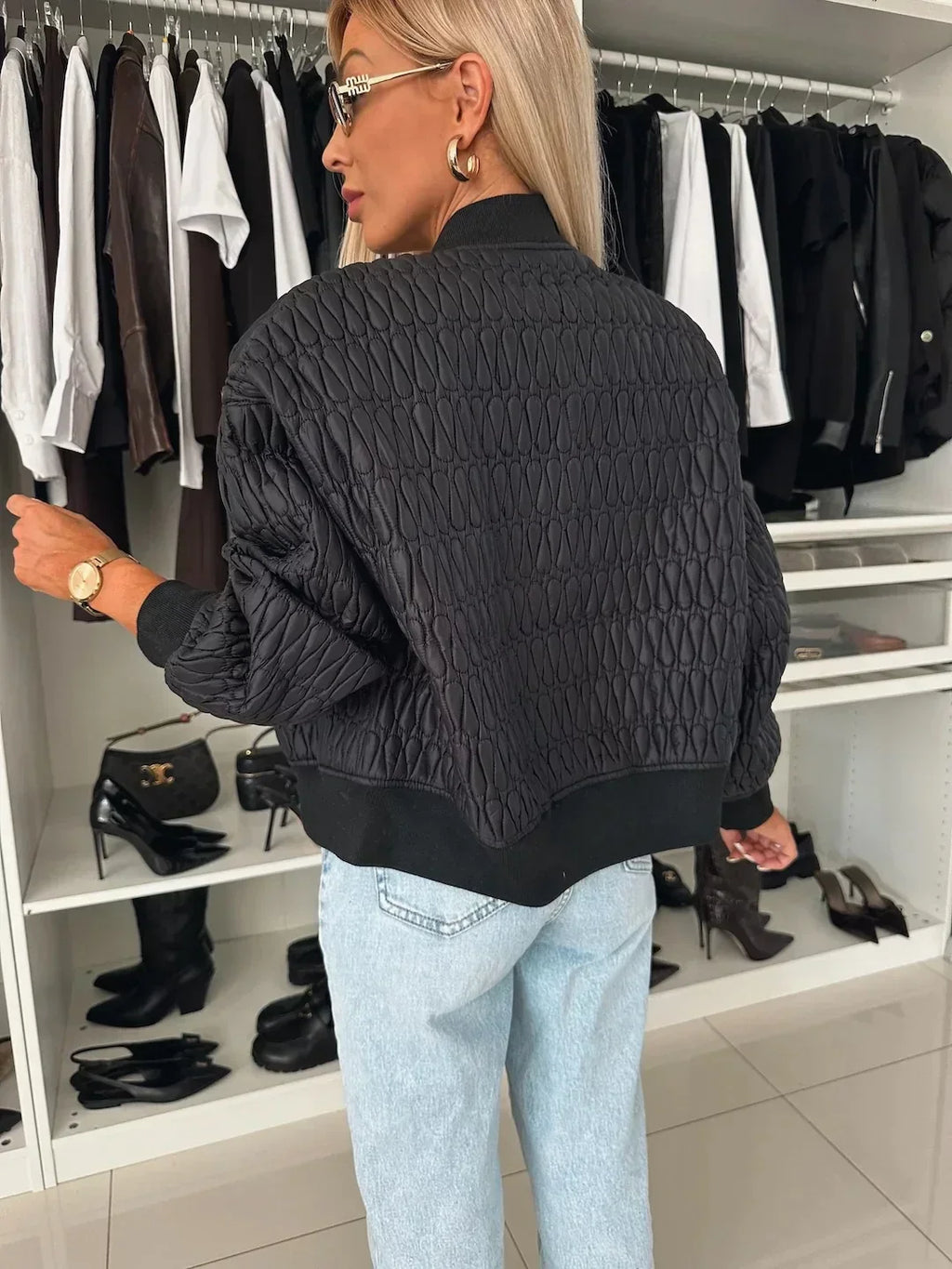 Jesie-London Isabella women's quilted zip-up bomber jacket displayed on a model, showcasing stylish outerwear with a quilted design.