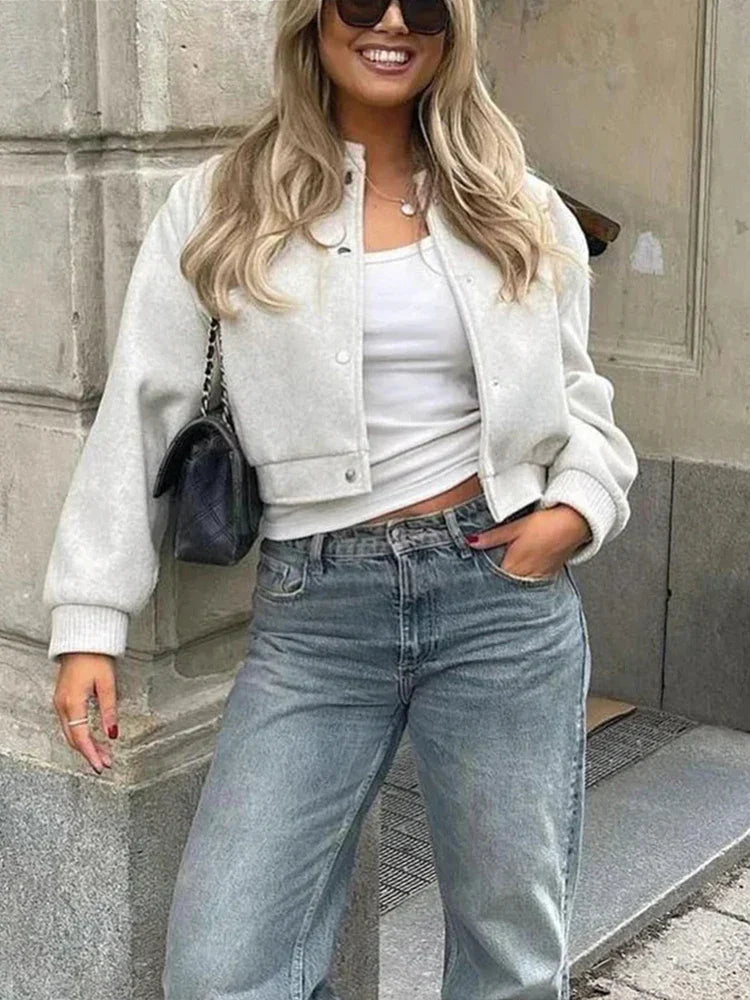 Jasmine women's cropped bomber jacket by Jesie-London with snap buttons, ribbed fabric, and front button closure.
