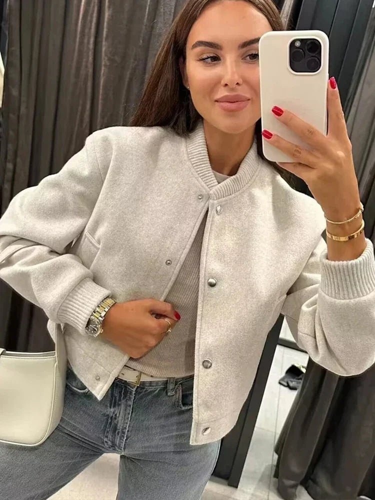 Women's cropped bomber jacket with snap buttons, ribbed design, in jasmine color from Jesie-London.