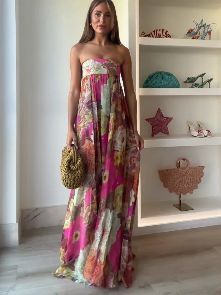 Jesie-London Ivy women's strapless floral maxi dress for wedding guests, featuring a flowing design and vibrant floral pattern.
