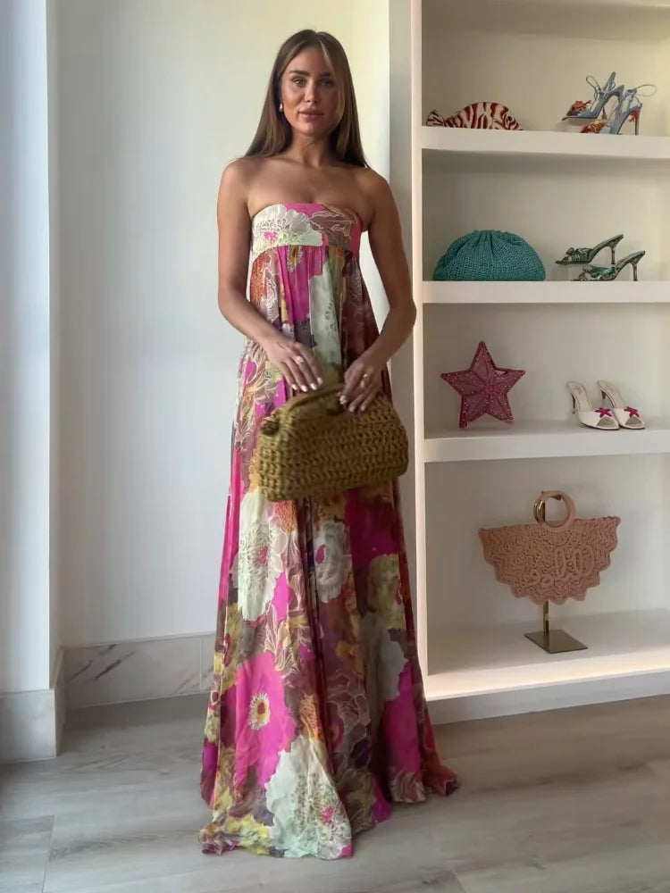 Jesie-London Ivy women's strapless floral maxi dress for wedding guests, featuring a flowing design and vibrant floral pattern.