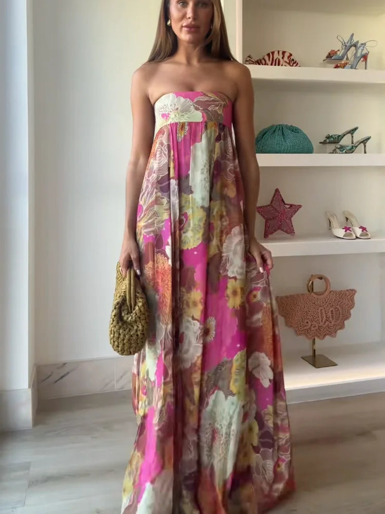 Jesie-London Ivy women's strapless floral maxi wedding guest dress, flowing fabric with vibrant floral pattern and elegant design.
