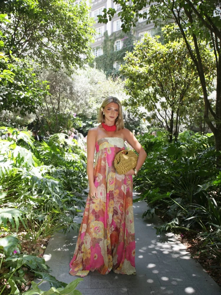 Jesie-London Ivy women's strapless floral maxi wedding guest dress, elegant sleeveless gown with vibrant floral pattern.