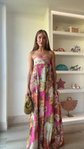 Jesie-London Ivy women's strapless floral maxi wedding guest dress with flowing fabric and vibrant flower pattern.