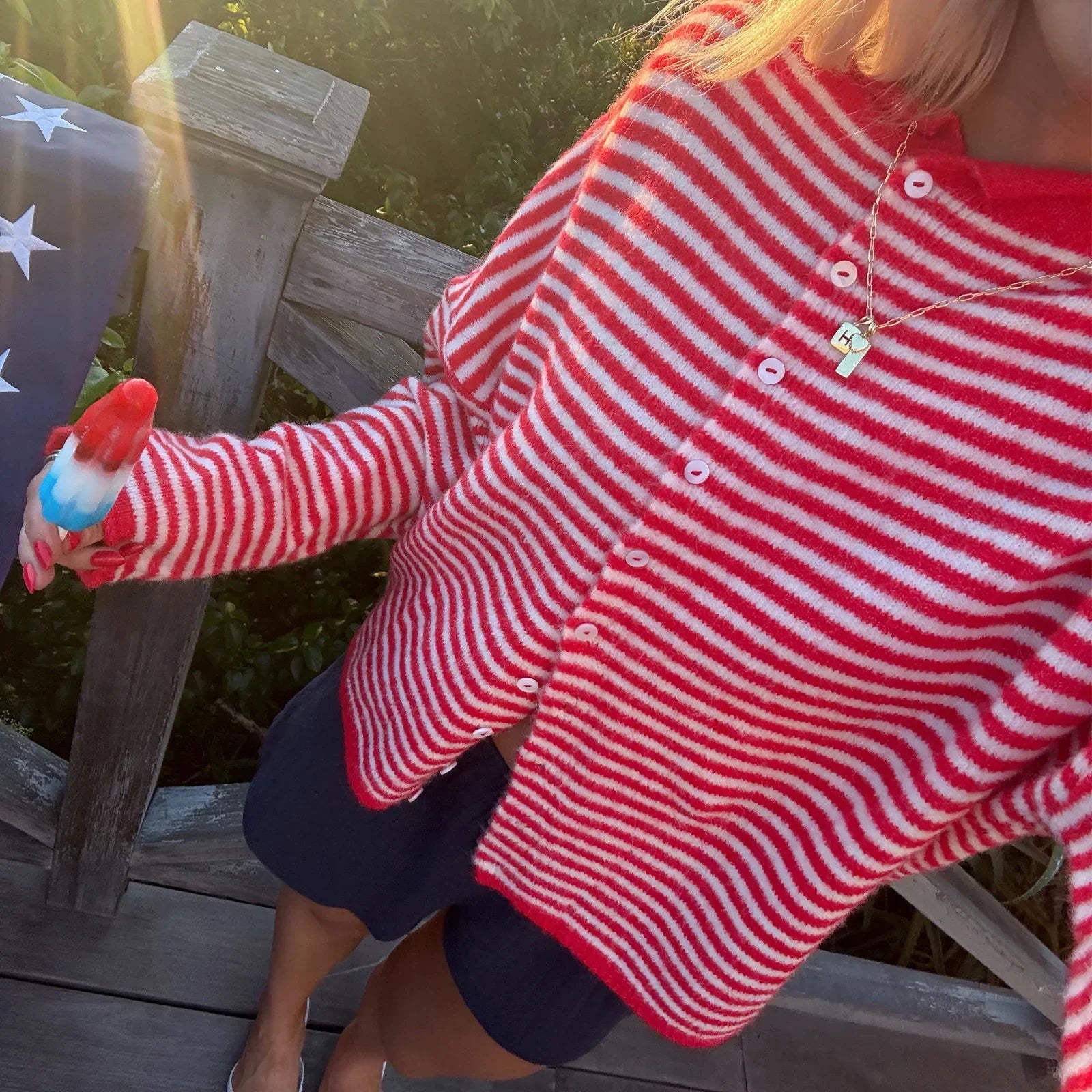 Women's striped button-front cardigan sweater by Jesie-London, featuring a stylish design and cozy knit fabric.