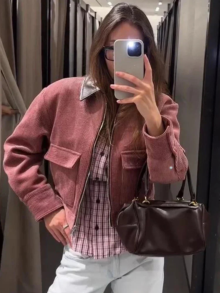 Women's cropped zip-up bomber jacket with flap pockets by Jesie-London, shown in a front view with a fitted style.