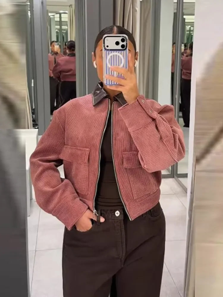 Women's cropped zip-up bomber jacket with flap pockets by Jesie-London, shown in a stylish front view.