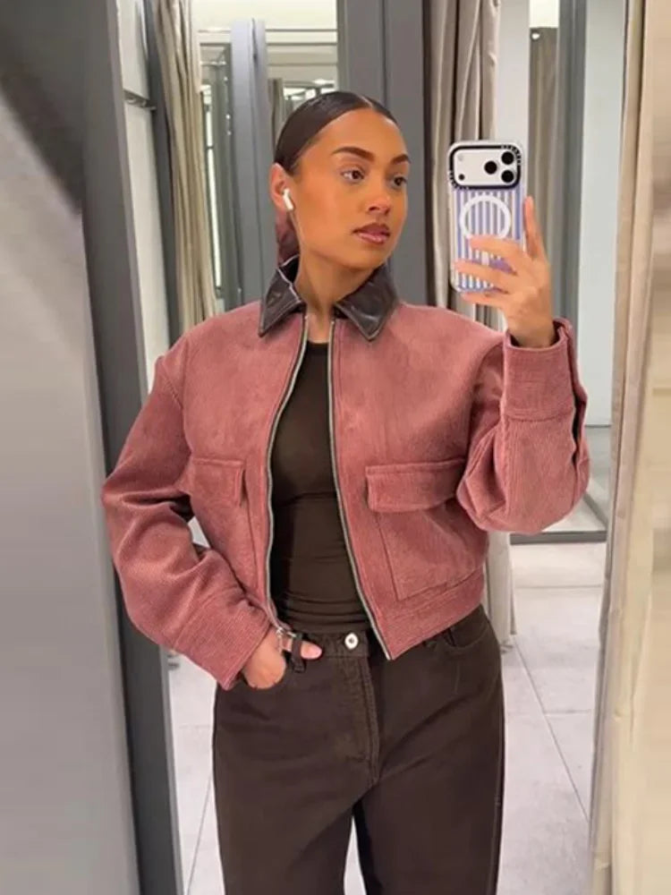 Women's cropped zip-up bomber jacket with flap pockets by Jesie-London, featuring a stylish zip front and modern design.
