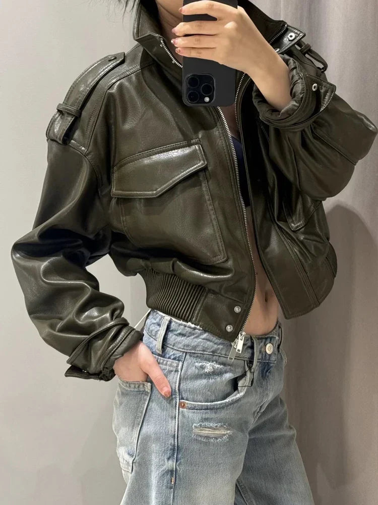 Laura women's zip-up biker style jacket by Jesie-London with front pockets, cropped leather-look design, and stand-up collar.