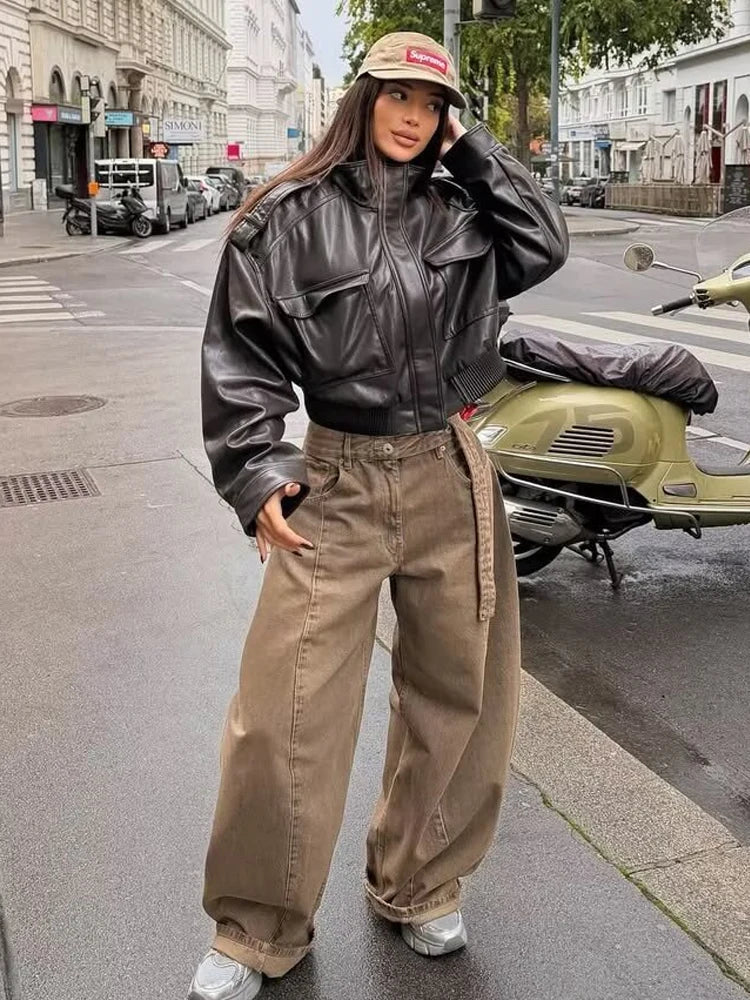 Women's zip-up biker style jacket with front pockets in a leather-look finish by Jesie-London