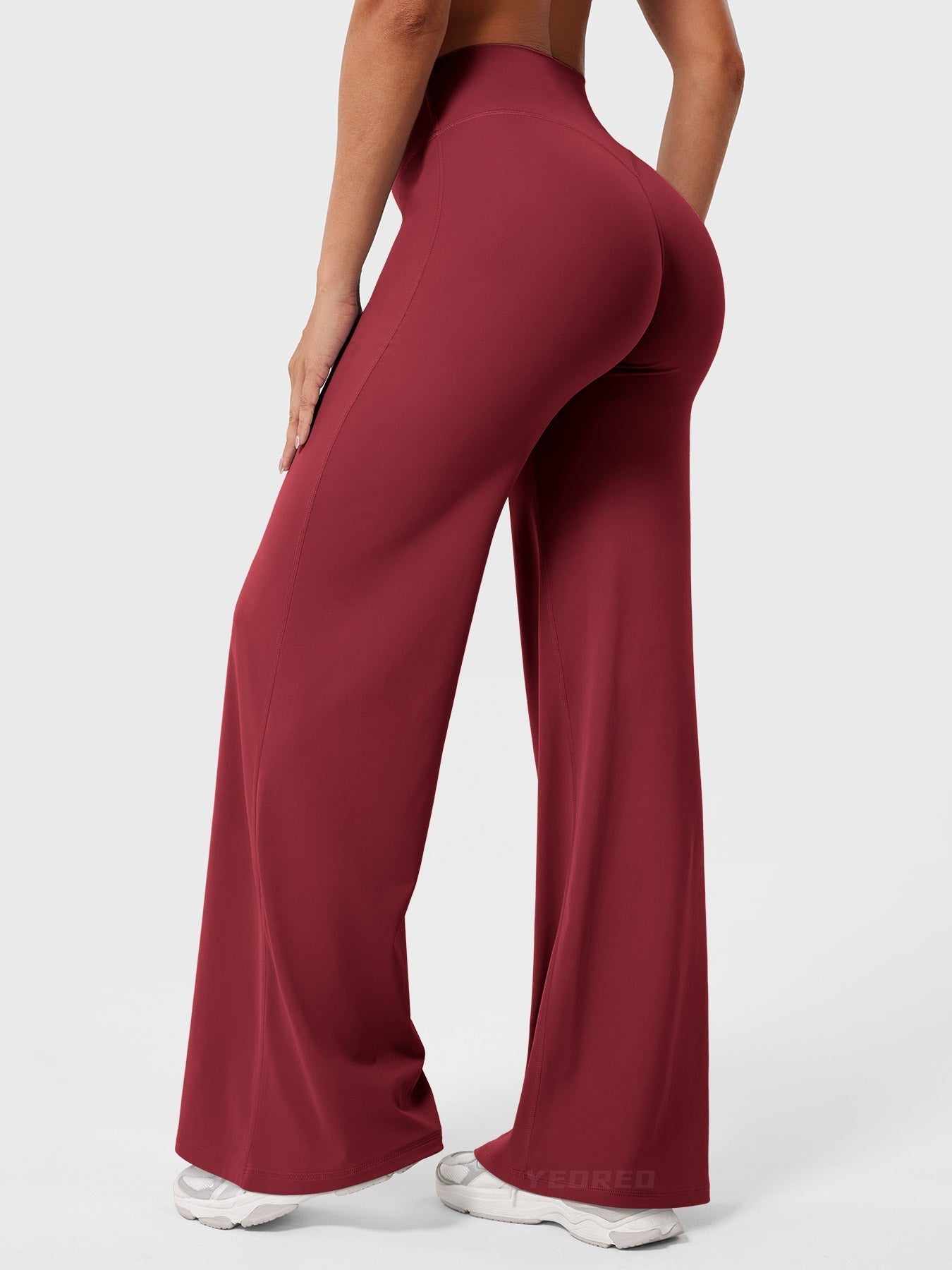 Red high waist flared pants for women by Jesie-London, featuring a summer-ready, stylish fit in a vibrant anchor print.