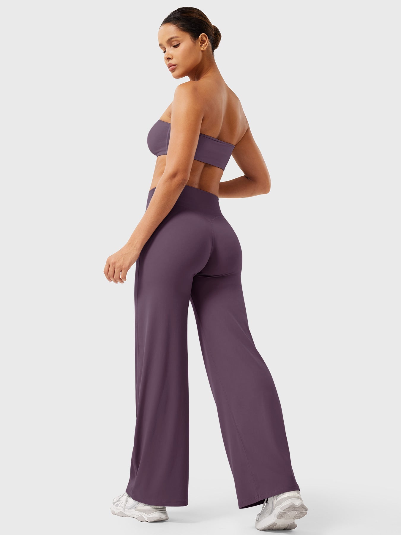 Women’s high waist flared pants by Jesie-London in black and purple, shown in a stylish summer outfit with a relaxed fit.