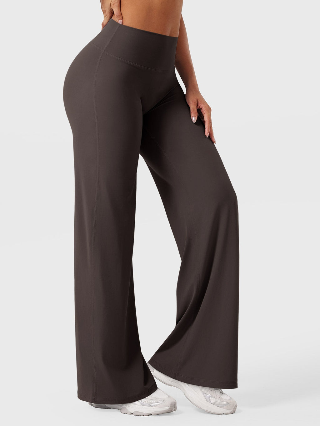Dark brown women's high waist flared pants from Jesie-London's Millie summer collection, styled with a relaxed fit.
