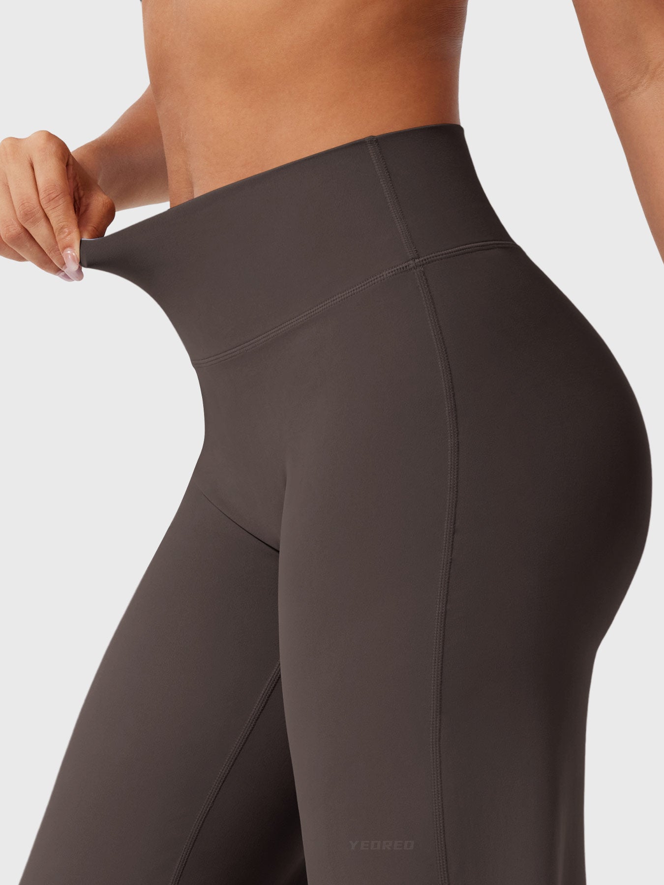 Dark brown women's high waist flared summer pants by Jesie-London, featuring a stylish, flowing silhouette and comfortable fit.