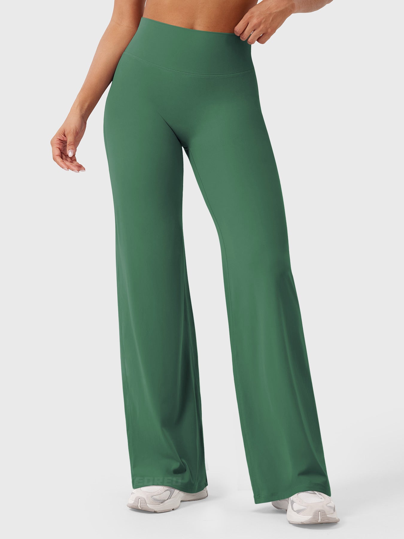 Dark green women's high waist flared pants by Jesie-London, styled for summer, with a relaxed fit and flowing silhouette.