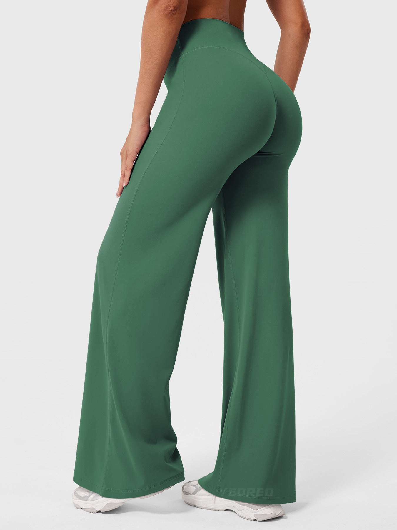 Dark green Millie women's summer high waist flared pants by Jesie-London, shown on a model, featuring a flowy, comfortable fit.