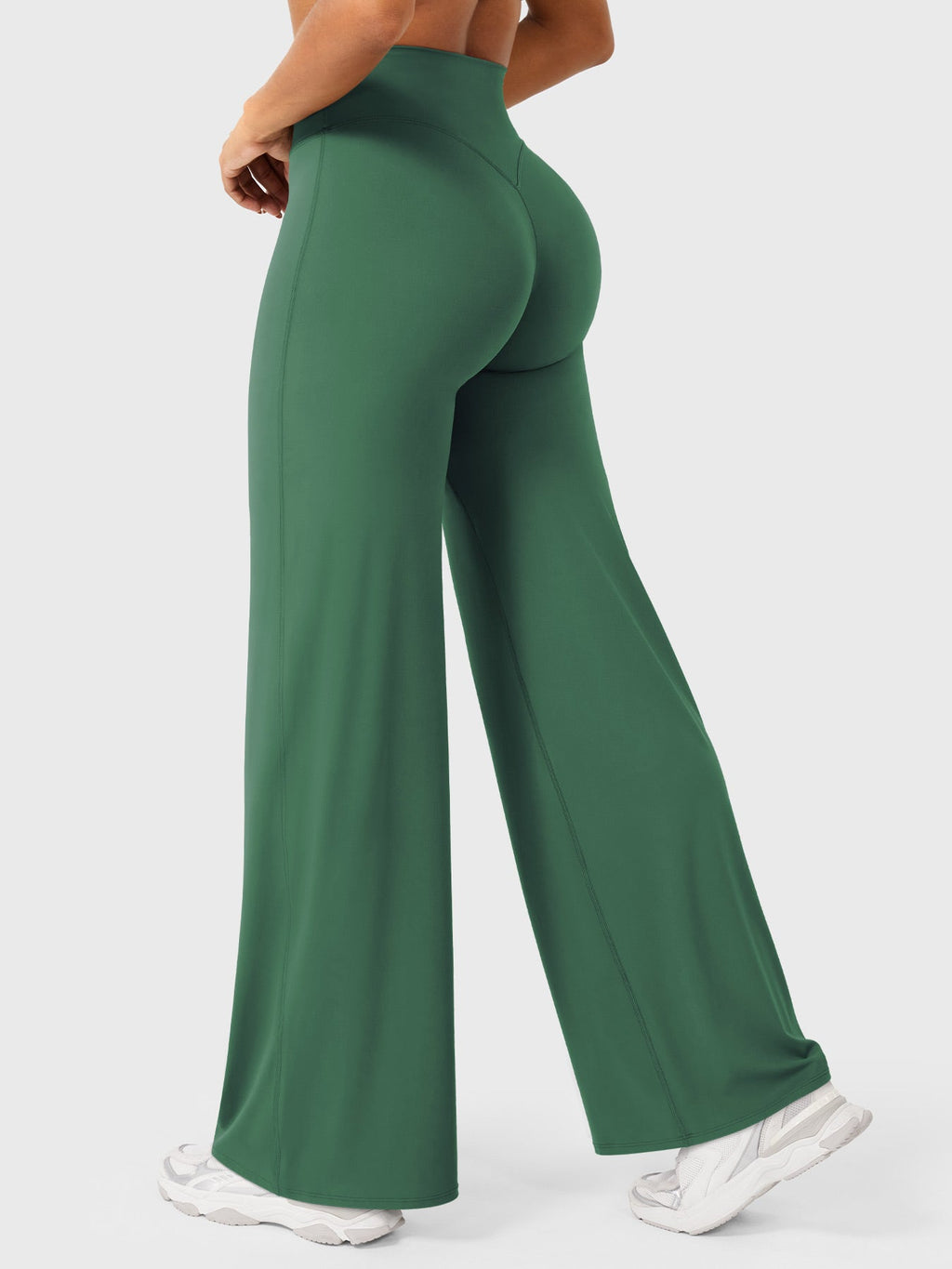 Dark green women's high waist flared pants from Jesie-London's Millie summer collection, styled with a relaxed fit and flowy fabric.