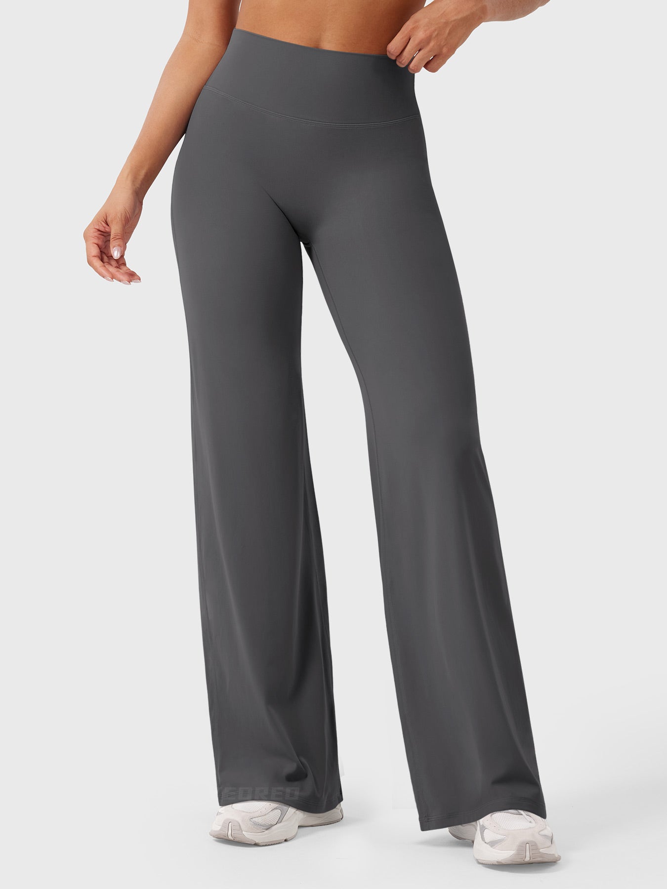 Dark grey women's high waist flared pants, Millie by Jesie-London, styled as summer women's fashion, shown on a model.