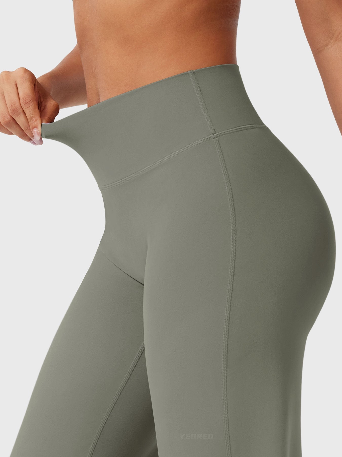 Grey-green women’s high waist flared summer pants from Jesie-London, styled with a relaxed fit and wide legs.