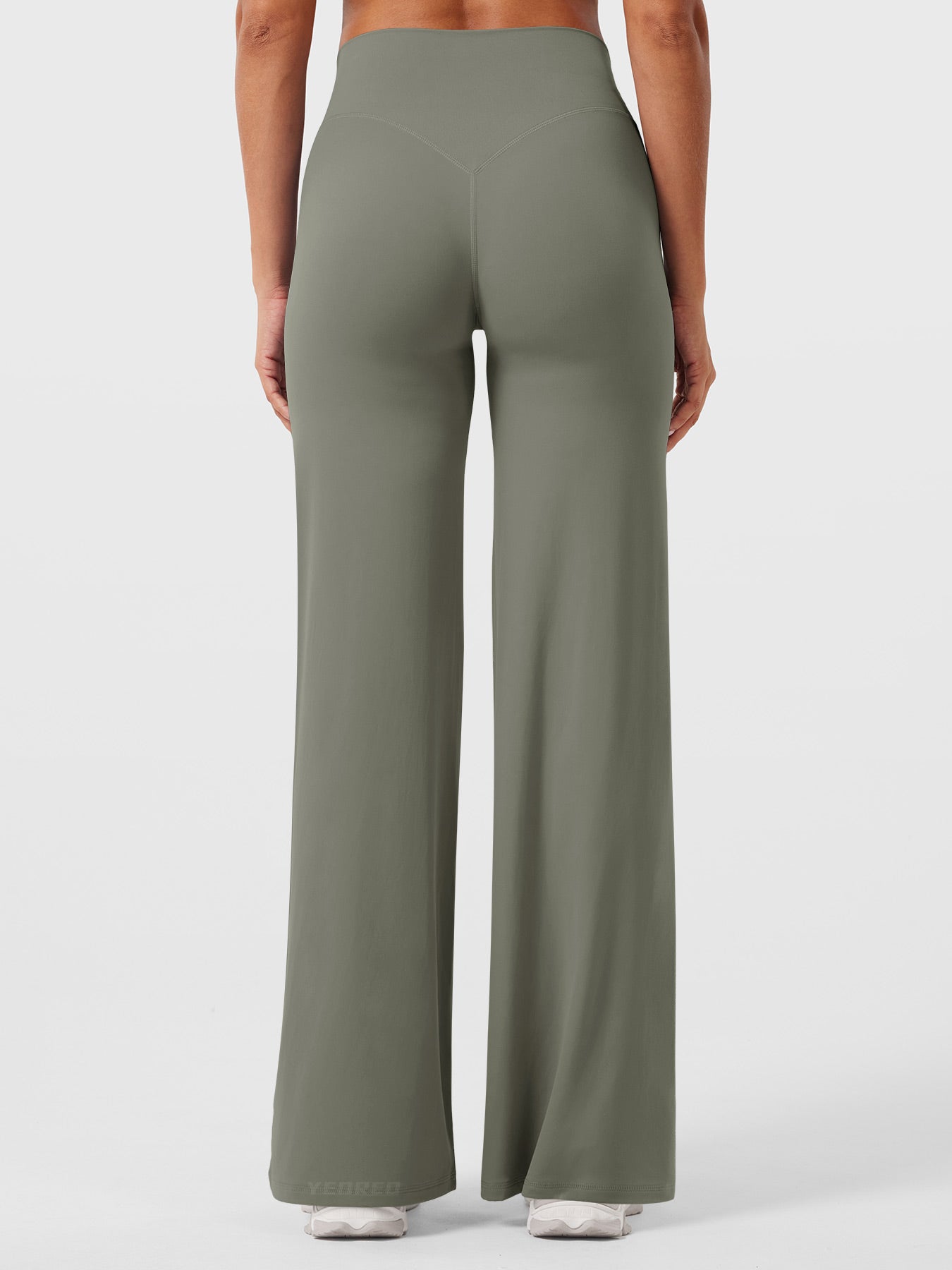 Grey-green women's high waist flared pants by Jesie-London, styled for summer wear, with a comfortable fit and flowy silhouette.
