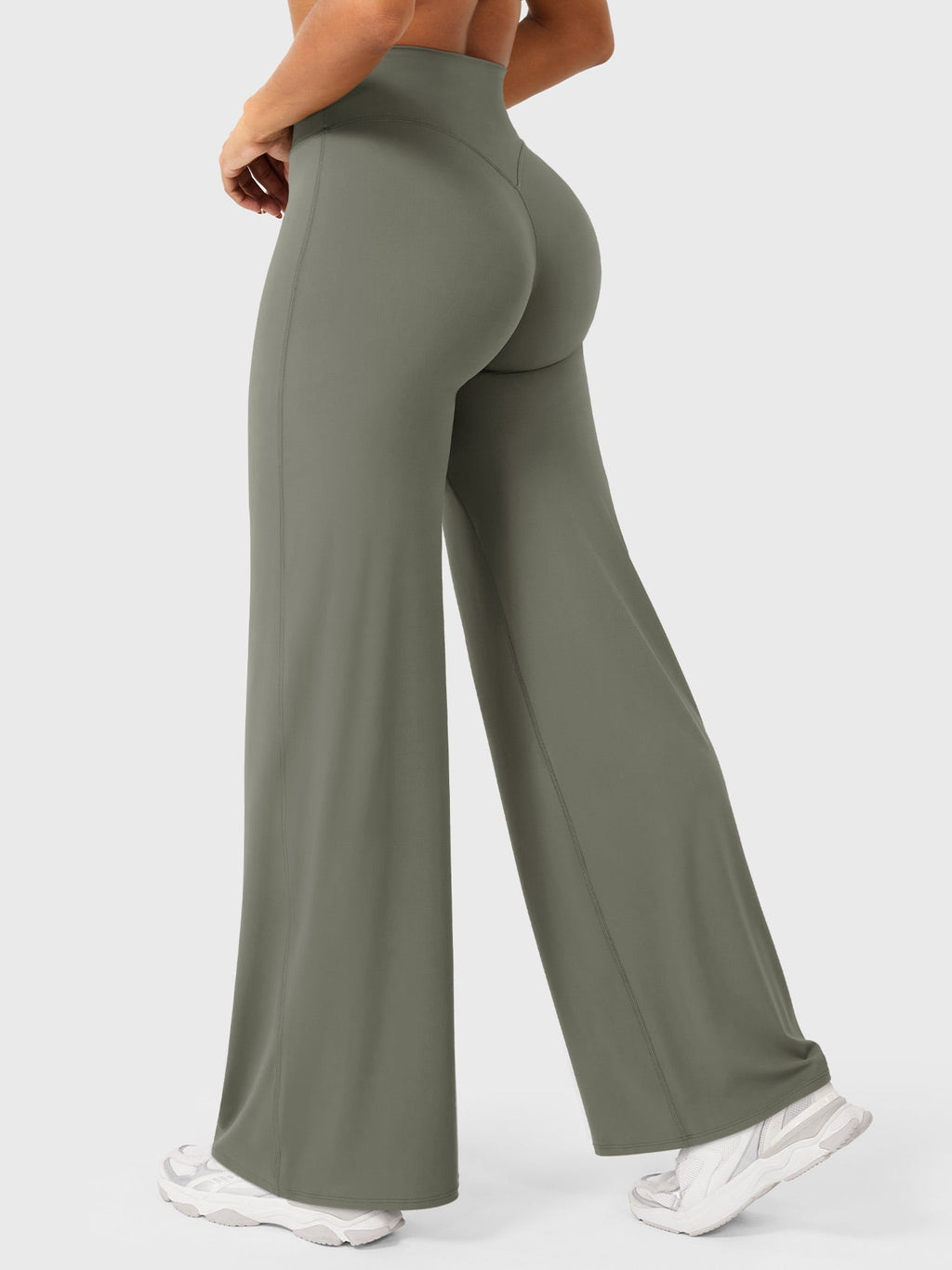 Grey-green women's high waist flared pants from Jesie-London, called Millie, styled with a relaxed fit and wide leg silhouette.