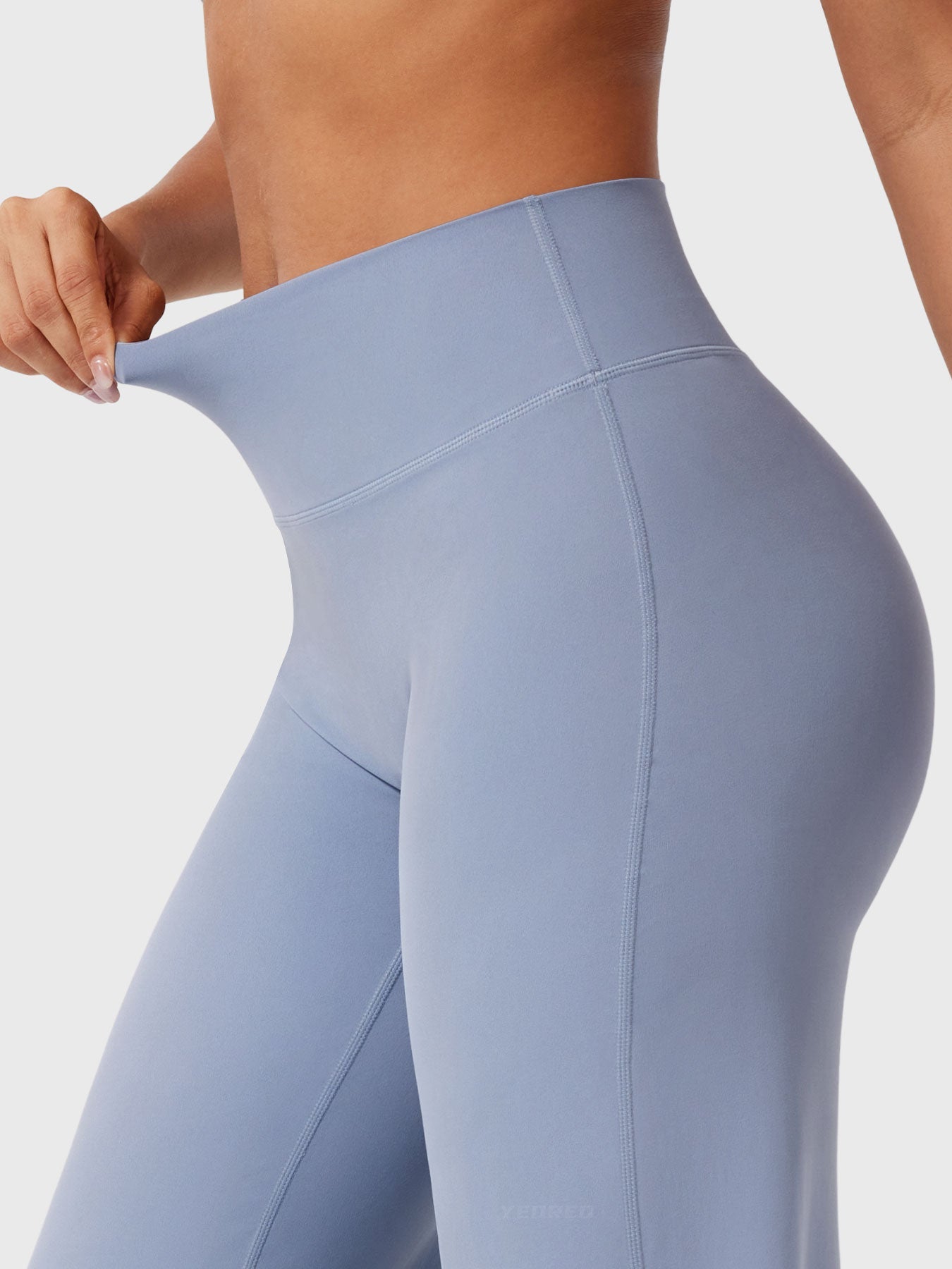 Millie women's summer high waist flared pants in haze blue by Jesie-London, styled with a casual top and accessories.