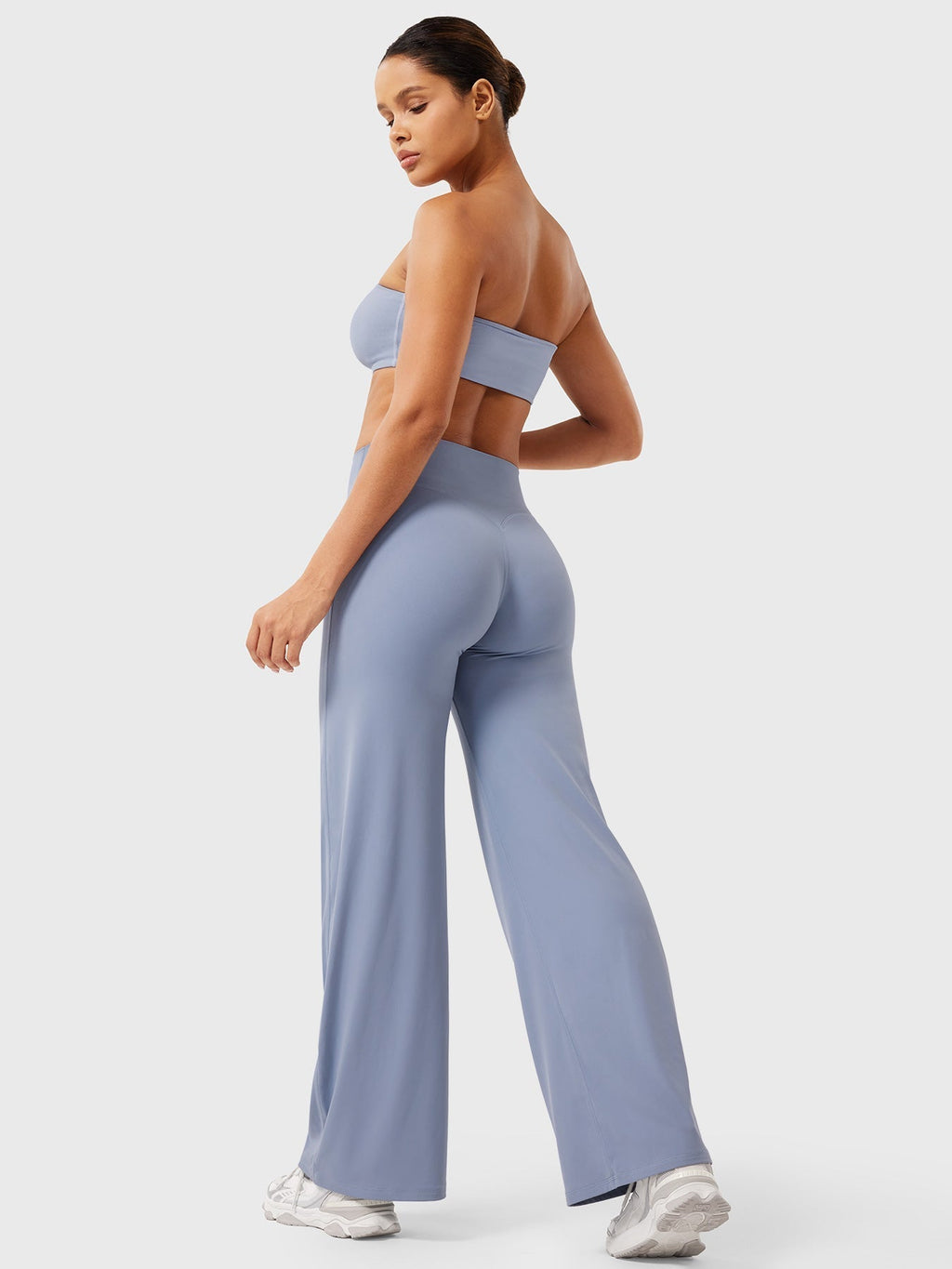 Millie women’s high waist flared pants in haze blue by Jesie-London, featuring a summer-ready, flowy fabric and stylish fit.