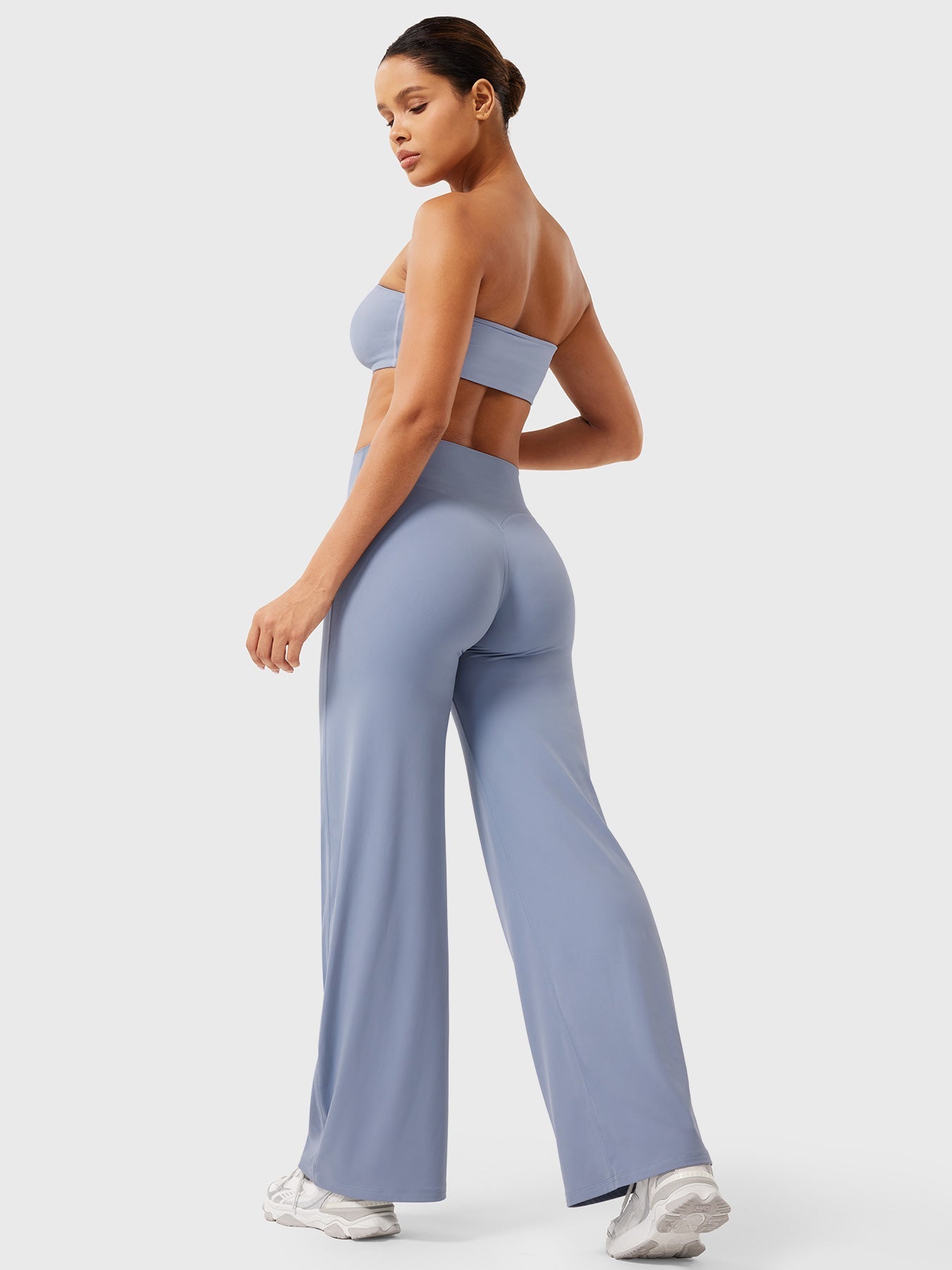 Millie women’s high waist flared pants in haze blue by Jesie-London, featuring a summer-ready, flowy fabric and stylish fit.