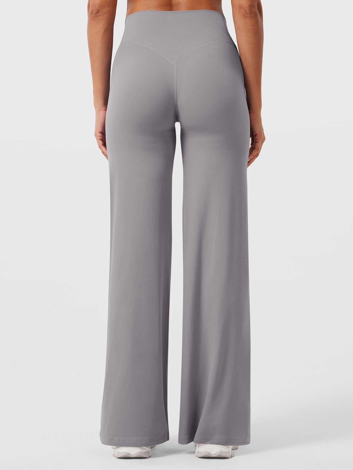 Light grey women's high waist flared pants from Jesie-London's Millie summer collection, shown on a model.