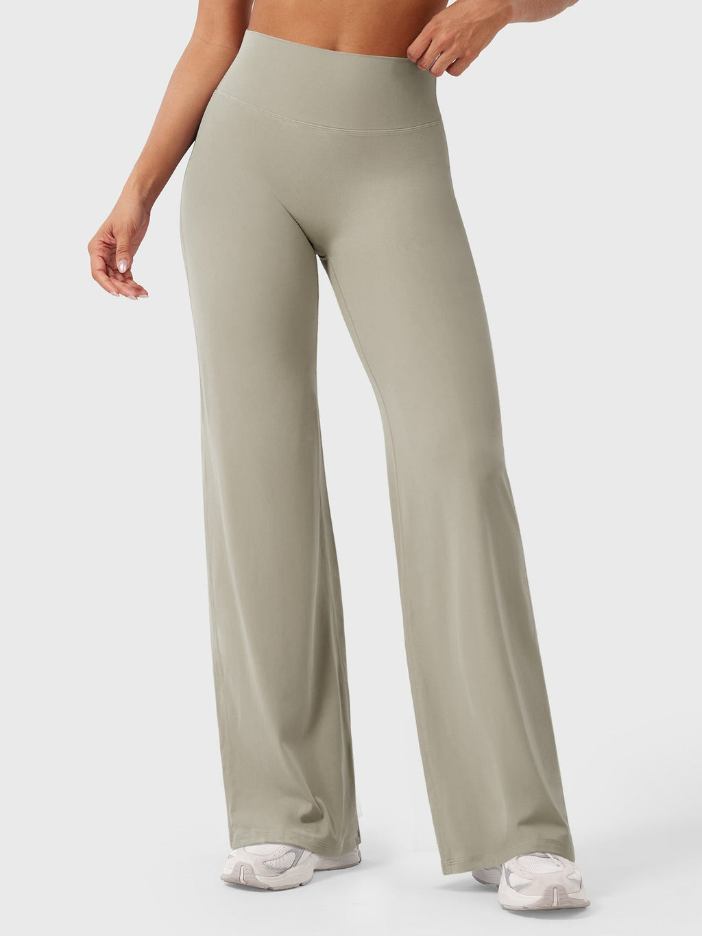Light sand-colored women's high waist flared pants from Jesie-London, featuring a relaxed summer fit and stylish design.