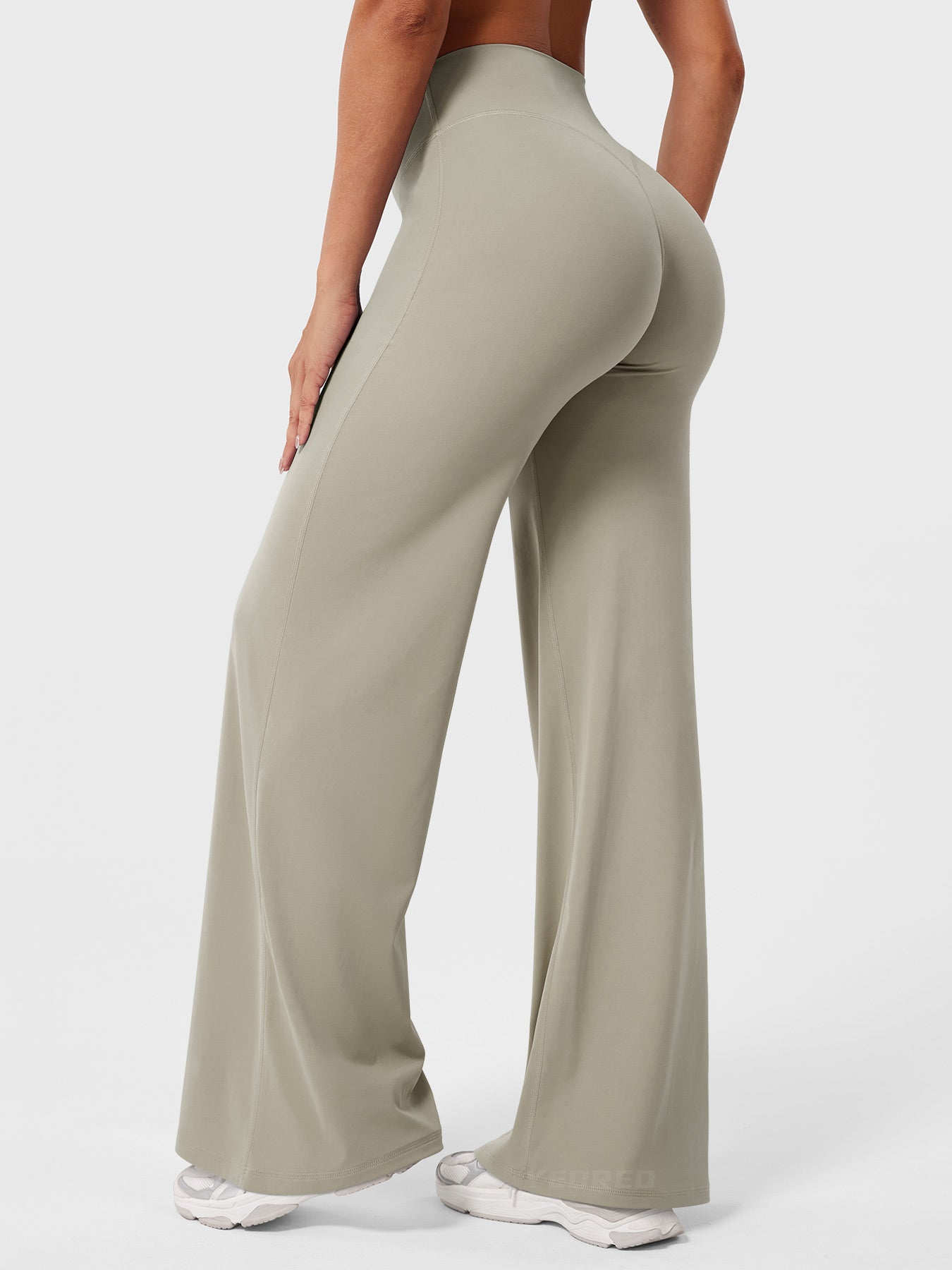 Light Sand high waist flared pants for women, Jesie-London Millie summer fashion, shown on a model with a casual pose.