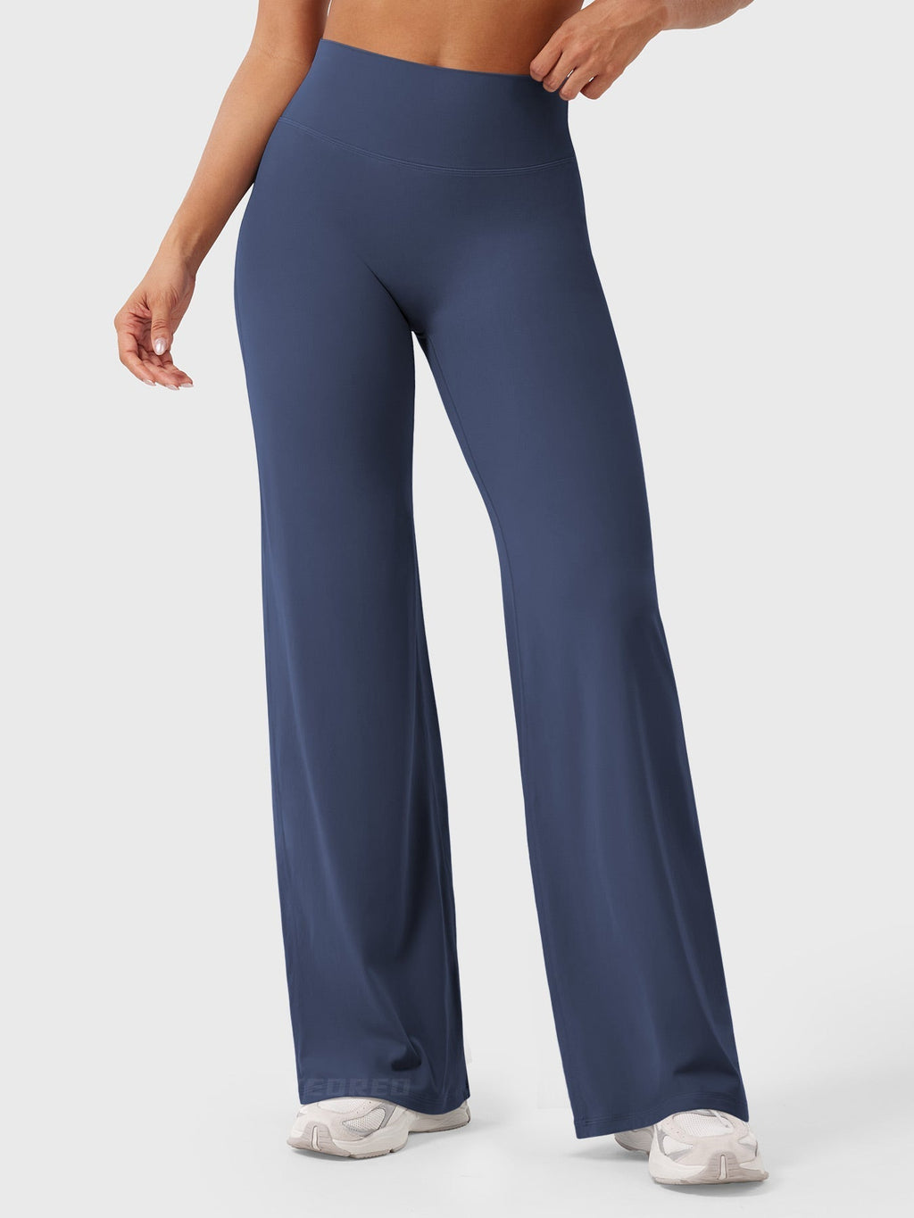 Navy blue women's high waist flared pants from Jesie-London's Millie summer collection, shown on a model.