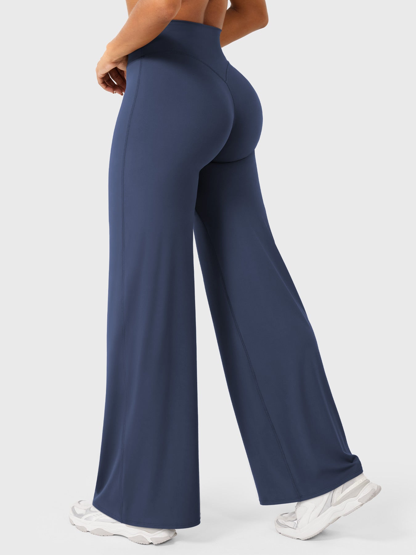 Navy blue high waist flared summer pants for women by Jesie-London, featuring a fitted waist and flowing wide-leg design.