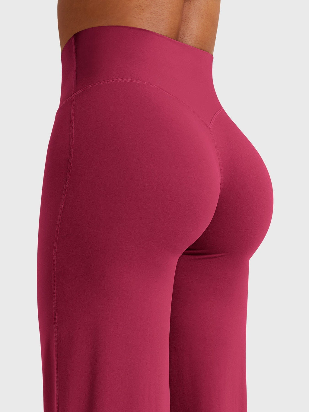 Millie women’s summer high waist flared pants in ruby red by Jesie-London, shown on a model with a relaxed fit and wide leg style.