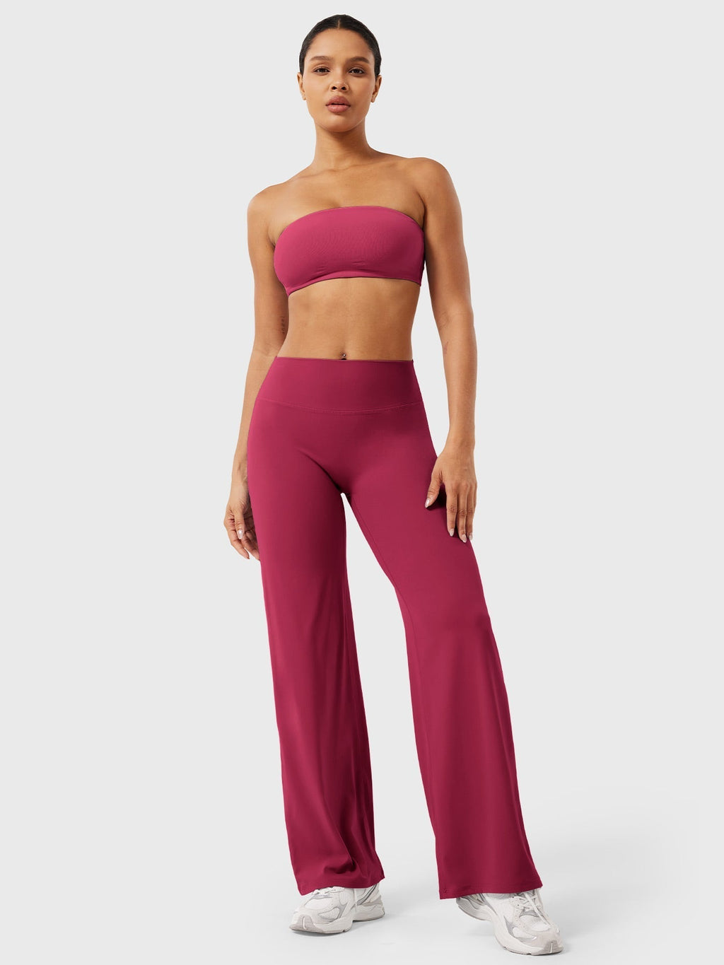Red high waist flared pants for women by Jesie-London, styled with a relaxed fit and summer-appropriate design.