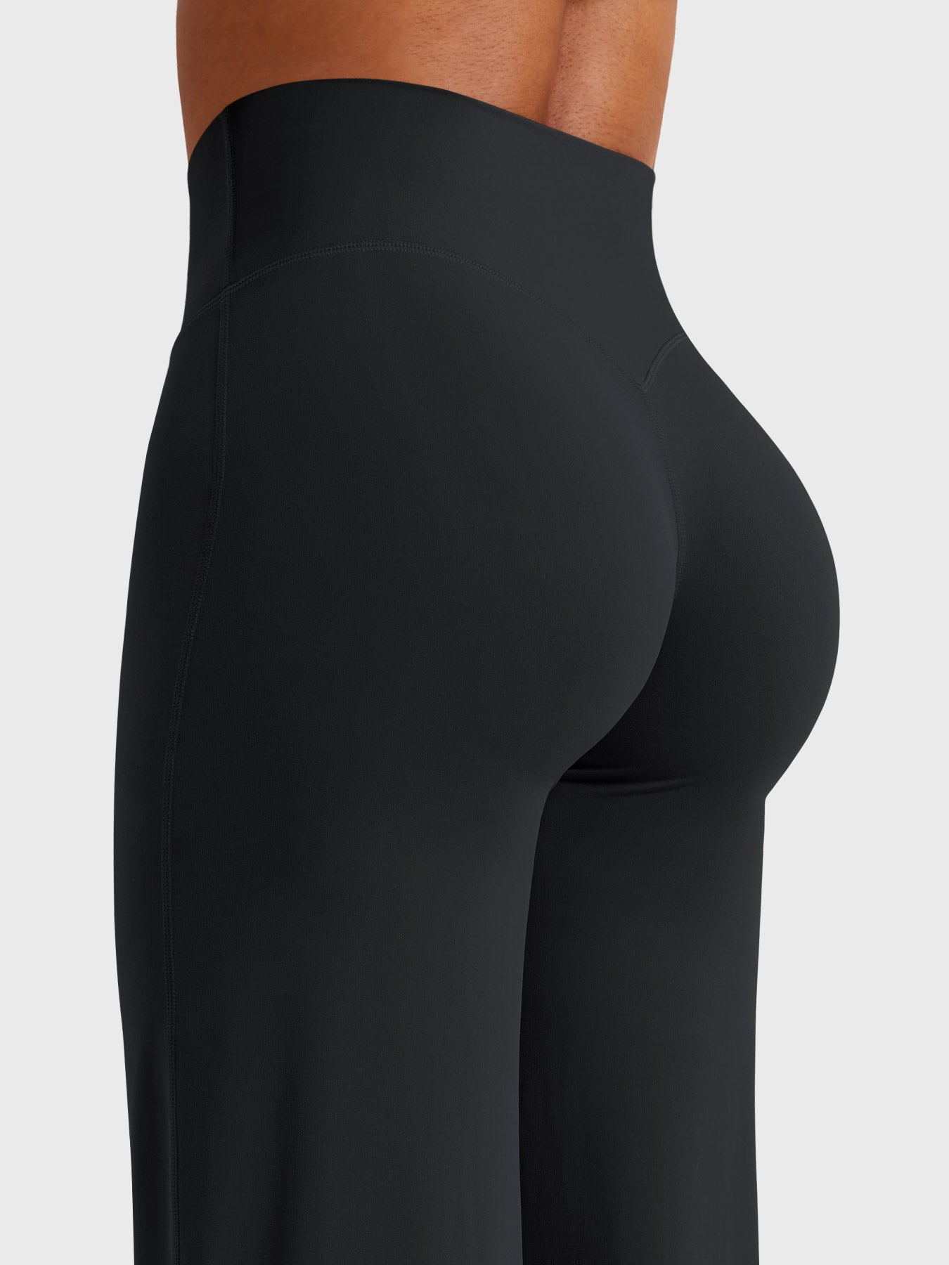 Black women's high waist flared pants from Jesie-London's Millie summer collection, shown on a model.
