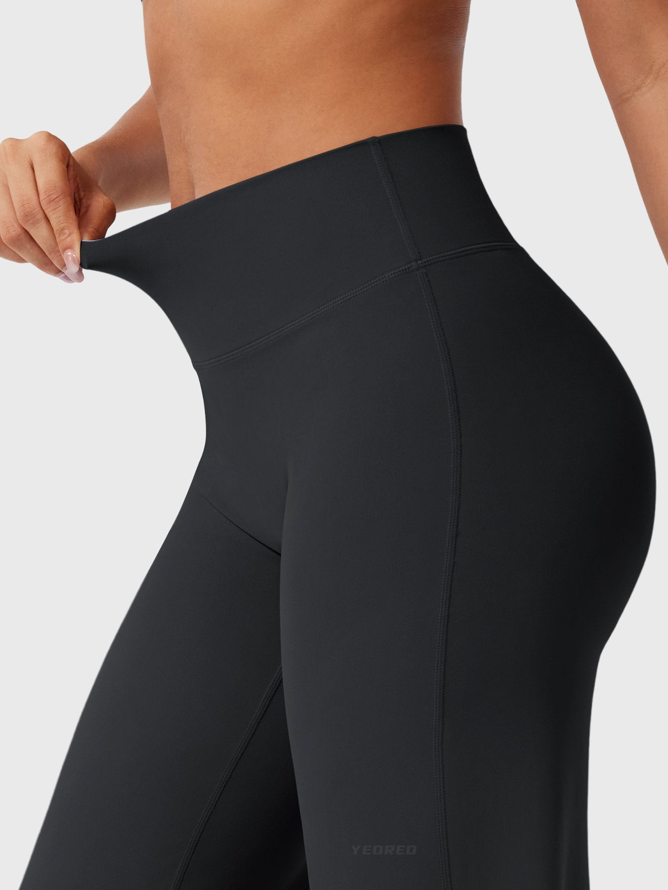 Black women's high waist flared pants from Jesie-London, featuring a summer-friendly, stylish fit and flowy silhouette.