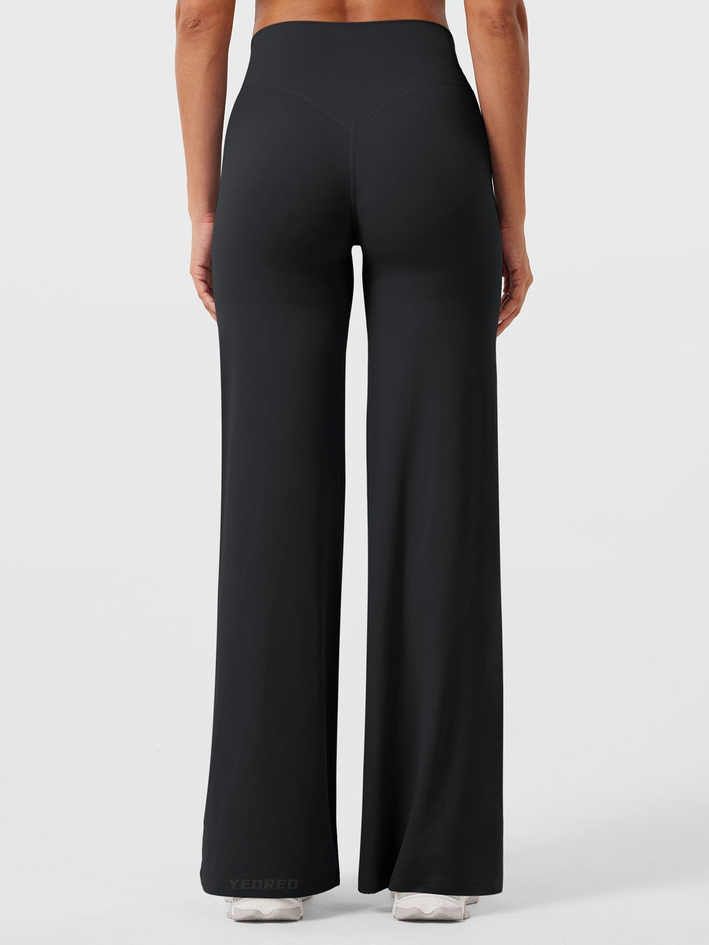 Black women's high waist flared pants from Jesie-London's Millie summer collection, featuring a flattering fit and flowy style.